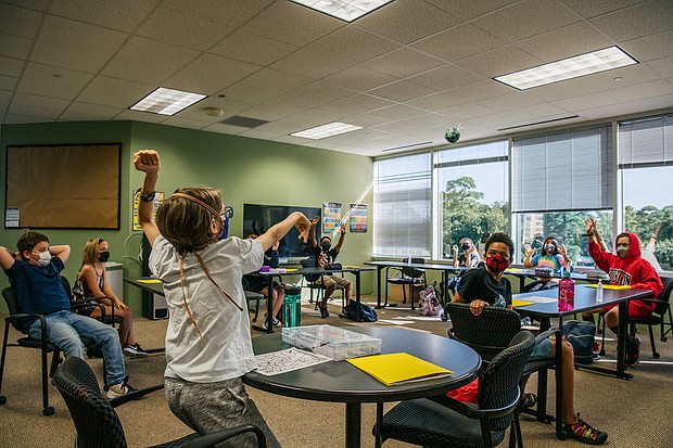 Most US public schools plan to keep masks optional for the start of classes. Children participate in a class activity at the Xavier Academy on August 23, 2021 in Houston, Texas.
Mandatory Credit:	Brandon Bell/Getty Images