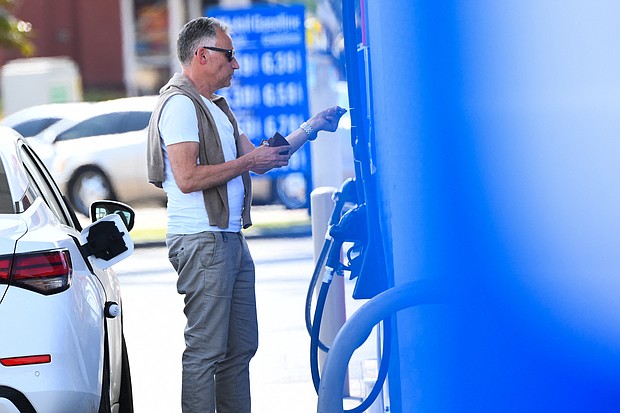 A customer uses a credit card before they pump gas at a Mobil gas station on April 28, in Los Angeles, California.
Mandatory Credit:	Patrick T. Fallon/AFP/Getty Images