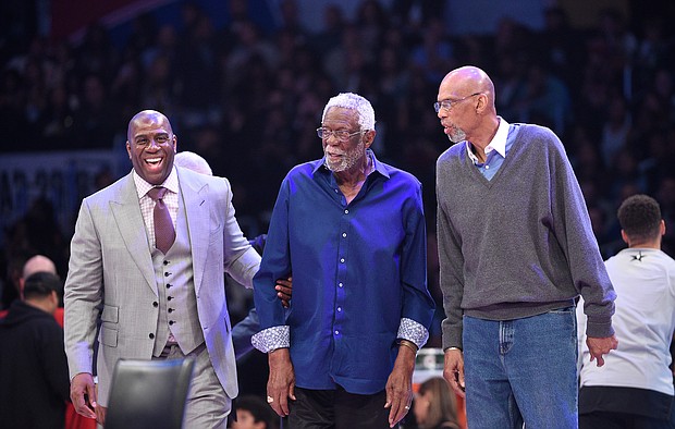 Six-time NBA champion Kareem Abdul-Jabbar, right, has paid tribute to the late Bill Russell, center, his mentor and friend who he said "leaves a giant example for us all."
Mandatory Credit: Kevork Djansezian/Getty Images North America/Getty Images