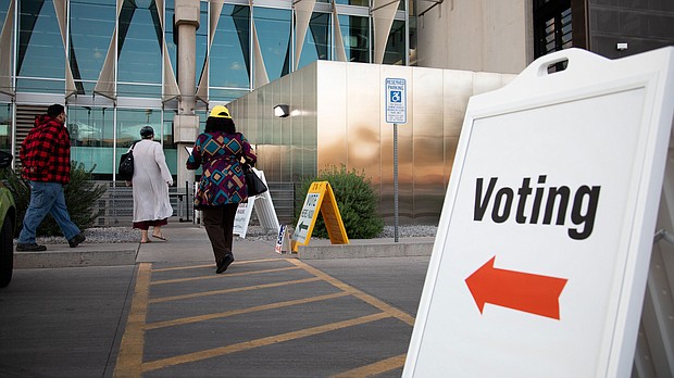 Voters enter Burton Barr Central Library to cast their ballots on November 3, 2020, in Phoenix, Arizona. August 2 is primary election day in Arizona, Kansas, Michigan, Missouri and Washington.
Mandatory Credit: Courtney Pedroza/Getty Images