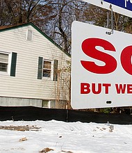 The housing market is showing signs of slowing. In this image, a "SOLD" sign hangs in front of a house in Vienna in Virginia, March 27, 2014.
Mandatory Credit:	Larry Downing/Reuters/FILE