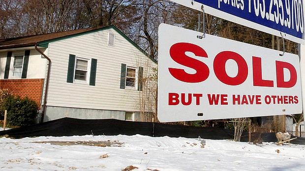 The housing market is showing signs of slowing. In this image, a "SOLD" sign hangs in front of a house in Vienna in Virginia, March 27, 2014.
Mandatory Credit:	Larry Downing/Reuters/FILE