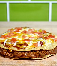 Taco Bell's Mexican Pizza is coming back in September.
Mandatory Credit:	Joshua Blanchard/Getty Images for Taco Bell