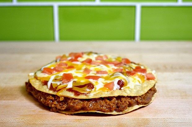 Taco Bell's Mexican Pizza is coming back in September.
Mandatory Credit: Joshua Blanchard/Getty Images for Taco Bell