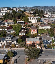 Homes in Albany, California, are seen here in May. Mortgage rates dropped for the second week in a row in August, falling below 5% for the first time since mid-April.
Mandatory Credit:	David Paul Morris/Bloomberg/Getty Images