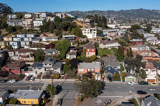Homes in Albany, California, are seen here in May. Mortgage rates dropped for the second week in a row in August, falling below 5% for the first time since mid-April.
Mandatory Credit:	David Paul Morris/Bloomberg/Getty Images