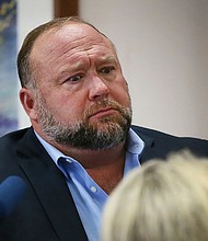 Conspiracy theorist Alex Jones attempts to answer questions about his emails asked by Mark Bankston, lawyer for a pair of Sandy Hook parents, during trial at the Travis County Courthouse in Austin on August 3.
Mandatory Credit:	Briana Sanchez/AP