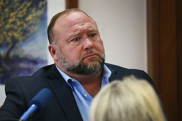 Conspiracy theorist Alex Jones attempts to answer questions about his emails asked by Mark Bankston, lawyer for a pair of Sandy Hook parents, during trial at the Travis County Courthouse in Austin on August 3.
Mandatory Credit:	Briana Sanchez/AP