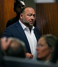 Right-wing talk show host Alex Jones will have to pay the parents of a Sandy Hook shooting victim a little more than $4 million in compensatory damages, a jury decided on August 4. Jones is seen here at the Travis County Courthouse in Austin, Texas on July 28.
Mandatory Credit:	Briana Sanchez/Pool/Reuters