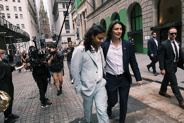 Robinhood got off to a rocky start when it made its Wall Street debut, but hopes for the trading app were high as armchair investors piled into the market hoping to mint quick fortunes. Baiju Bhatt (left) and Vlad Tenev, Robinhood founders are pictured here.
Mandatory Credit:	Spencer Platt/Getty Images