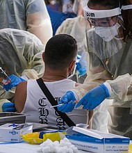 A healthcare worker is seen here preparing the monkeypox vaccine in Los Angeles in July. The US Department of Health and Human Services waited more than three weeks after the first confirmed case of monkeypox in the US to order bulk stocks of the vaccine in fear they may lose years of shelf life.
Mandatory Credit:	Ringo Chiu/AP/FILE