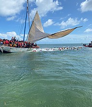 A sailboat full of Haitian migrants grounded near the Florida Keys Saturday, US officials said.
Mandatory Credit:	Courtesy US Coast Guard