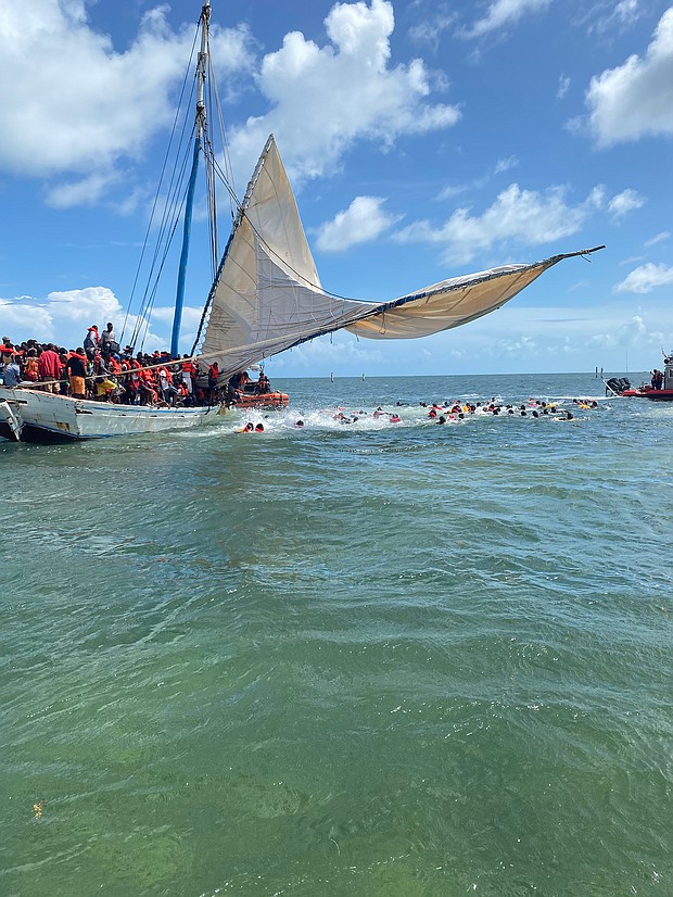 A sailboat full of Haitian migrants grounded near the Florida Keys Saturday, US officials said.
Mandatory Credit:	Courtesy US Coast Guard