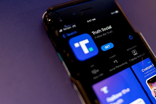 After facing a series of regulatory obstacles, the shell company attempting to take over former President Donald Trump's social media platform needs to extend a looming deadline to complete the controversial deal. A phone screen displays the Truth Social app in February.
Mandatory Credit:	Stefani Reynolds/AFP/Getty Images