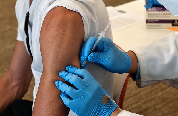 An analysis of monkeypox case records published by the US Centers for Disease Control and Prevention on August 5 offers new insight into the outbreak, which is disproportionately affecting men who have sex with men, especially those who are Black and Hispanic. A patient is seen receiving the vaccine on August 3 in California.
Mandatory Credit:	Richard Vogel/AP