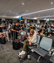 Travelers wait for their flight at Los Angeles International Airport. According to the flight tracking website, FlightAware, there have been 200 flights canceled so far on August 8. On August 7, 950 flights were canceled.
Mandatory Credit:	Michael Ho Wai Lee/SOPA Images/Sipa