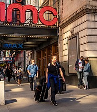 Shares of movie theater chain AMC, video game retailer GameStop and struggling home furnishings retailer Bed Bath & Beyond soared on August 8, extending the prior week's big gains. The AMC Empire 25 Cinemas in Times Square is pictured here in May.
Mandatory Credit:	Richard B. Levine/ZUMA Press