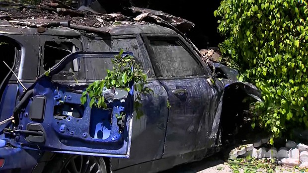 Anne Heche's mini cooper is pictured here following the accident.
Mandatory Credit:	KCAL/KCBS