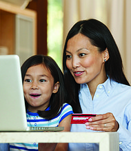 Photo courtesy of Getty Images (mother and daughter shopping online)
