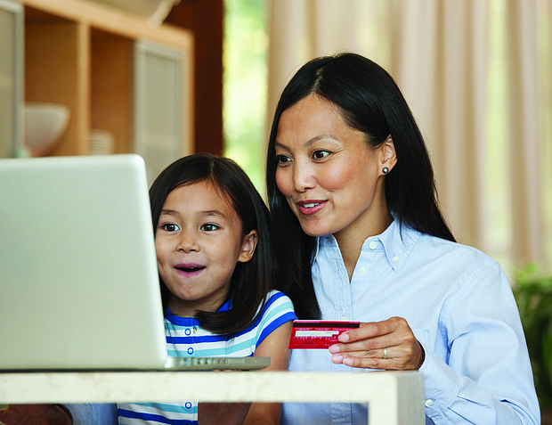 Photo courtesy of Getty Images (mother and daughter shopping online)