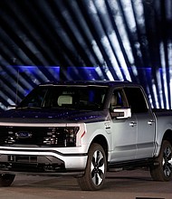 On August 11, Ford will once again begin taking orders for its popular F-150 Lightning electric pickup truck, pictured here in Dearborn, Michigan, in May 2021. But this time the base model of the pickup will cost about $7,000 more than before.
Mandatory Credit:	Jeff Kowalsky/AFP/Getty Images