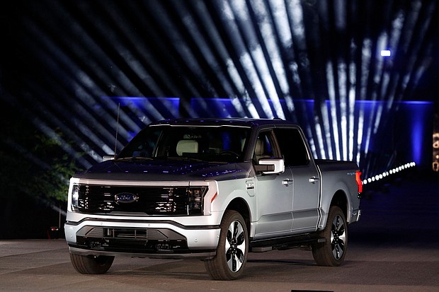On August 11, Ford will once again begin taking orders for its popular F-150 Lightning electric pickup truck, pictured here in Dearborn, Michigan, in May 2021. But this time the base model of the pickup will cost about $7,000 more than before.
Mandatory Credit:	Jeff Kowalsky/AFP/Getty Images