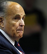 Giuliani looks on during an appearance before the Michigan House Oversight Committee in Lansing, Michigan, on December 2, 2020.
Mandatory Credit:	Jeff Kowalsky/AFP/Getty Images