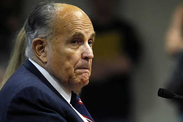 Giuliani looks on during an appearance before the Michigan House Oversight Committee in Lansing, Michigan, on December 2, 2020.
Mandatory Credit:	Jeff Kowalsky/AFP/Getty Images