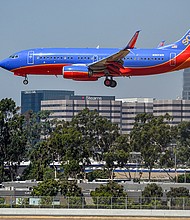 A Southwest Airlines flight attendant suffered a back injury in July after the plane’s hard landing, according to the National Transportation Safety Board. A Southwest jet is pictured at John Wayne Airport in 2017.
Mandatory Credit:	Jeff Gritchen/Digital First Media/Orange County Register/Getty Images
