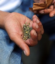 A man prepares to smoke K2 or "Spice," a synthetic marijuana drug, along a street in East Harlem on August 5, 2015, in New York City.
Mandatory Credit:	Spencer Platt/Getty Images
