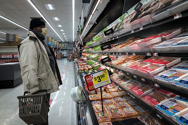 A man shops in the meat section of a grocery store, April 28, 2020 in Washington, DC. Food prices are still sky-high even though Inflation may be slowing overall.
Mandatory Credit:	Drew Angerer/Getty Images