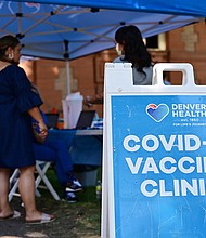 The US is on a Covid plateau. Pictured is a Covid-19 vaccine clinic in Denver, Colorado on Friday August 5.
Mandatory Credit:	Hyoung Chang/Denver Post/Getty Images