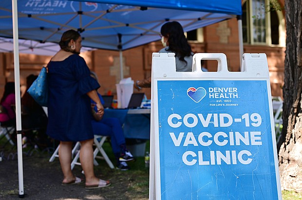 The US is on a Covid plateau. Pictured is a Covid-19 vaccine clinic in Denver, Colorado on Friday August 5.
Mandatory Credit:	Hyoung Chang/Denver Post/Getty Images