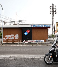 Seven years after its debut in Italy, Domino's has failed to sell pizza to the locals. A "For Sale" banner outside a closed-down Domino's Pizza Inc. store in Rome, Italy, is pictured here on August 9.
Mandatory Credit:	Alessia Pierdomenico/Bloomberg/Getty Images