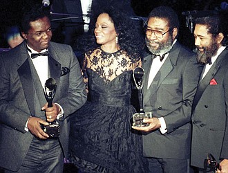 Singer Diana Ross, second from left, joins songwriters, from left, Lamont Dozier, Brian Holland and Eddie Holland after the writing team was inducted into the Rock and Roll Hall of Fame in New York on Jan. 17, 1990. Mr. Dozier, of the celebrated Holland-Dozier-Holland team, helped make Motown an essential record company of the 1960s and beyond.