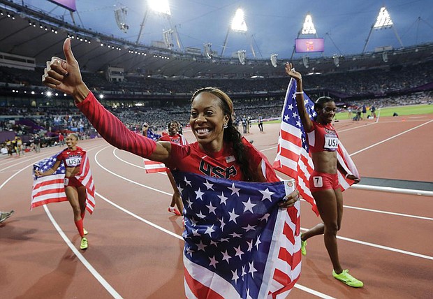Sanya Richards-Ross, front center, and Allyson Felix, back left, celebrate winning gold in the women’s 4x400 meter relay final during the athletics in the Olympic Stadium at the Summer Olympics in London in 2012. Ms. Richards-Ross revealed that two weeks before the 2008 Beijing Olympics, she had an abortion while in a relationship with her then-fiancé Aaron Ross.