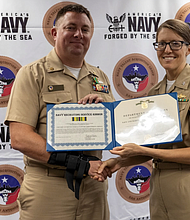 Photo By Edward Jones | JOINT BASE SAN ANTONIO-FORT SAM HOUSTON – (August 3, 2022) Chief Fire Controlman Christopher R. Johnson from Deer Park, Texas, poses with his Navy and Marine Corps Achievement award and NTAG San Antonio Commanding Officer, CDR. Stephanie Simoni.