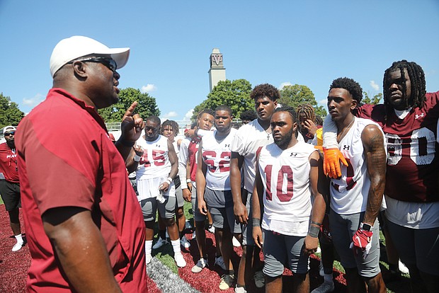 Virginia Union University’s head coach Alvin Parker, left, brings the Panthers’ first practice to a close after telling them his expectations and that he is looking for each player to work hard. The team’s first game is Thursday, Sept. 1, against Virginia University of Lynchburg at Hovey Field.