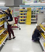 A parent shops for school supplies deals at a Target store, July 27, in North Miami, Florida.
Mandatory Credit:	Marta Lavandier/AP