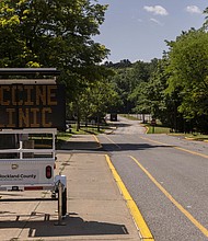 A sign guides drivers to a vaccine clinic at the Rockland County health department, in Pomona, New York, on July 22. New York Health officials are offering pop-up polio vaccinations and urging the public to get the shots.
Mandatory Credit:	Victor J. Blue/The New York Times/Redux