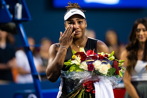 Carrying a bouquet of flowers and wiping a tear from her eye, Serena Williams waved to the raucous crowd on …