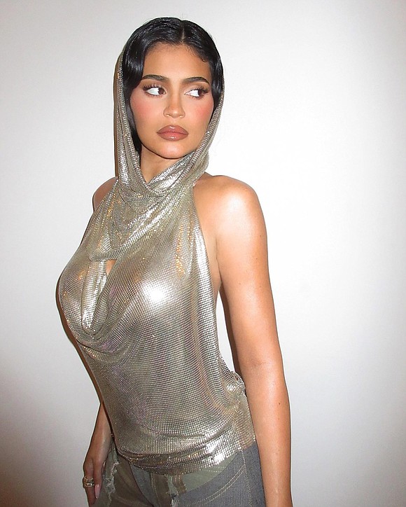 Kylie Jenner has made a strong case for glamorous party tops, channeling a disco ball and another famous Kylie, singer ...