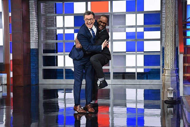 Stephen Colbert hugs his newly named bandleader Louis Cato.
Mandatory Credit:	Scott Kowalchyk/CBS