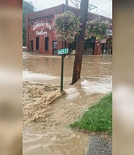 A view of a flooded street in front of the Kentucky Mist Distillery, following a day of heavy rain, in Whitesburg, Kentucky, on July 28, 2022.
Mandatory Credit:	Amber Elise Carter/Reuters