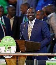 Kenya's Deputy President William Ruto speaks at the IEBC National Tallying Centre at the Bomas of Kenya in Nairobi on August 15.
Mandatory Credit: Thomas Mukoya/Reuters