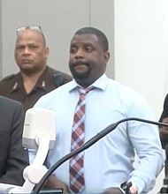 Anthony Fox, center, was convicted on culpable negligence manslaughter charges in the 2019 death of George Robinson and sentenced to 20 years in prison.
Mandatory Credit:	WAPT