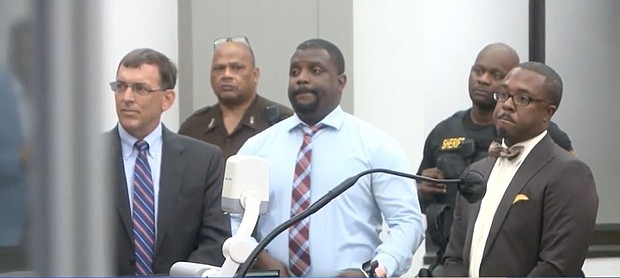 Anthony Fox, center, was convicted on culpable negligence manslaughter charges in the 2019 death of George Robinson and sentenced to 20 years in prison.
Mandatory Credit:	WAPT