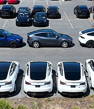 Following their latest price increase, Tesla's software will cost five times as much as when it was first introduced as a $3,000 add-on, even as it has developed slower than the automaker projected and faced criticism and government scrutiny.
Mandatory Credit:	Justin Sullivan/Getty Images