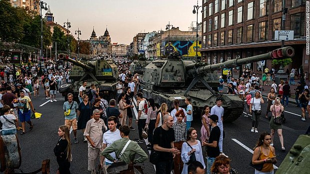 People gather in Kyiv to look at destroyed Russian military equipment.