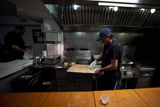 A cook prepares to put breaded chicken cutlets into a fryer at Bub and Pop's on August 19 in Washington, DC. Business activity at private US companies in early August dropped off at some of the sharpest rates seen since the beginning of the pandemic, according to data released on August 23.
Mandatory Credit:	Anna Moneymaker/Getty Images
